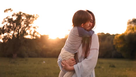 Loving-mother-and-son-hugging-outdoors-sunset.-Loving-mother-and-son-hugging-outdoors-on-sunset-during-their-summer-vacation